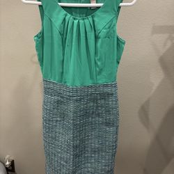 Banana Republic in green top with tweed skirt
