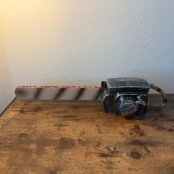 The Gemmy Halloween Chainsaw Costume Handheld Prop is a realistic and fun addition to your Halloween costume. With a color scheme of black, gray, and