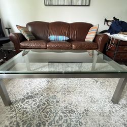 Modern glass and stainless coffee table
