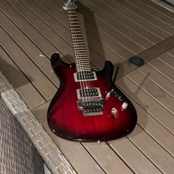 Ibanez S520 model, in a Blackberry Sunburst finish.