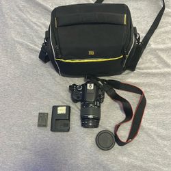 Canon Camera With Lens Battery Charger, And Bag