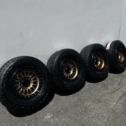 KMC KM552 IMS 6x5.5 17" Wheels Bronze With 33” Falken WildPeak AT4W All-Terrain Tires