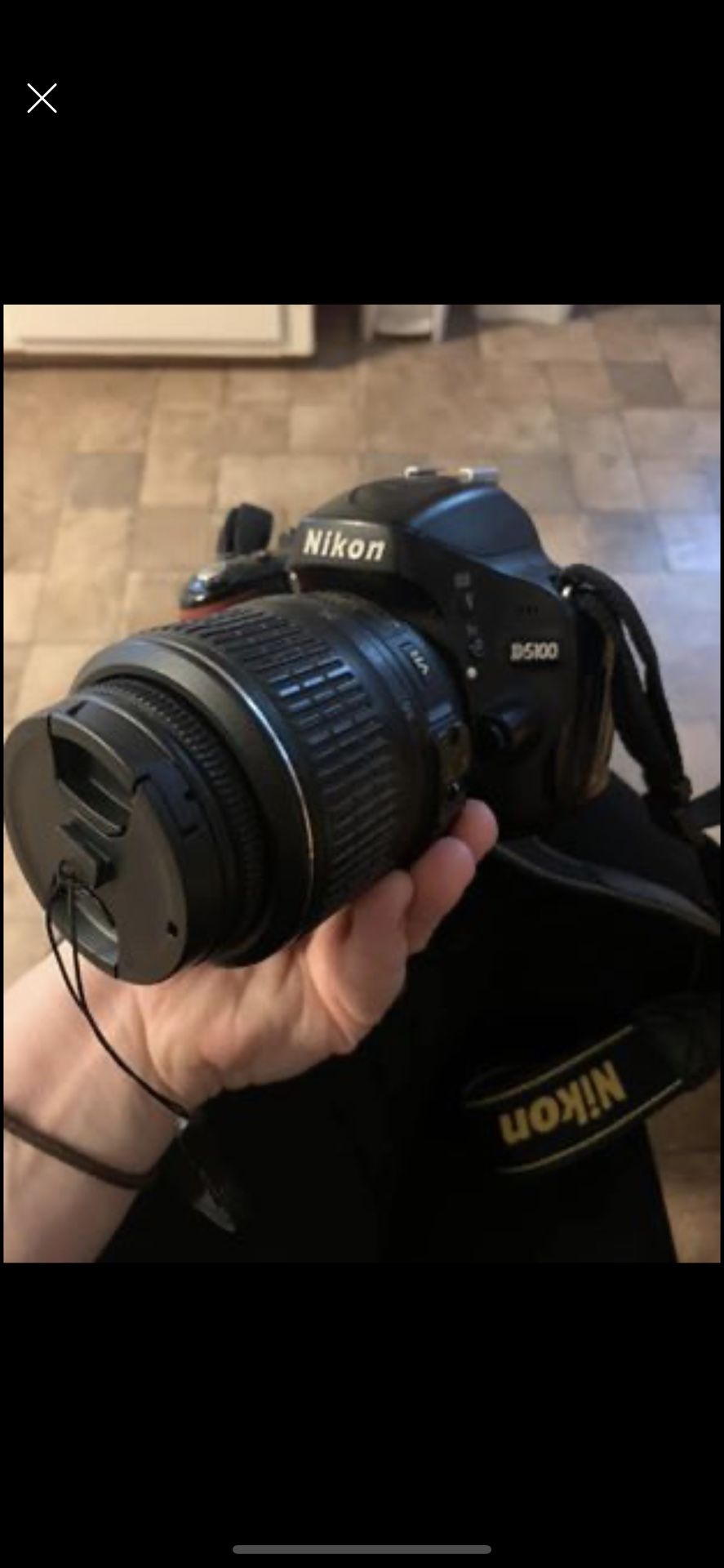 Nikon D5100 with kit lens and 55-200. iPhone memory card adapter.