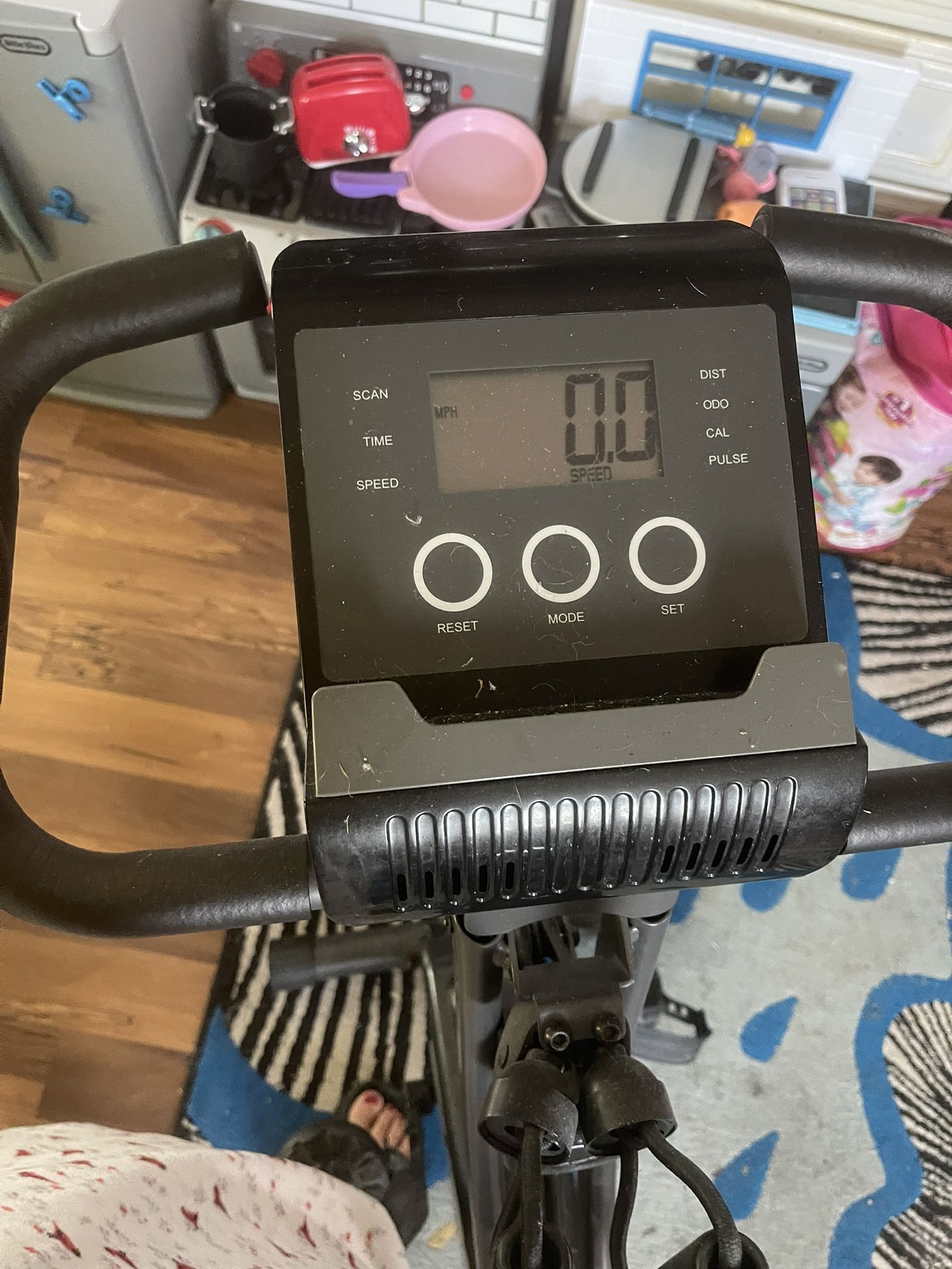 $20 exercise bike machine with digital display. It doesn’t lock into place so it has a bungee cord holds it up to store in up position. Everett pinehu