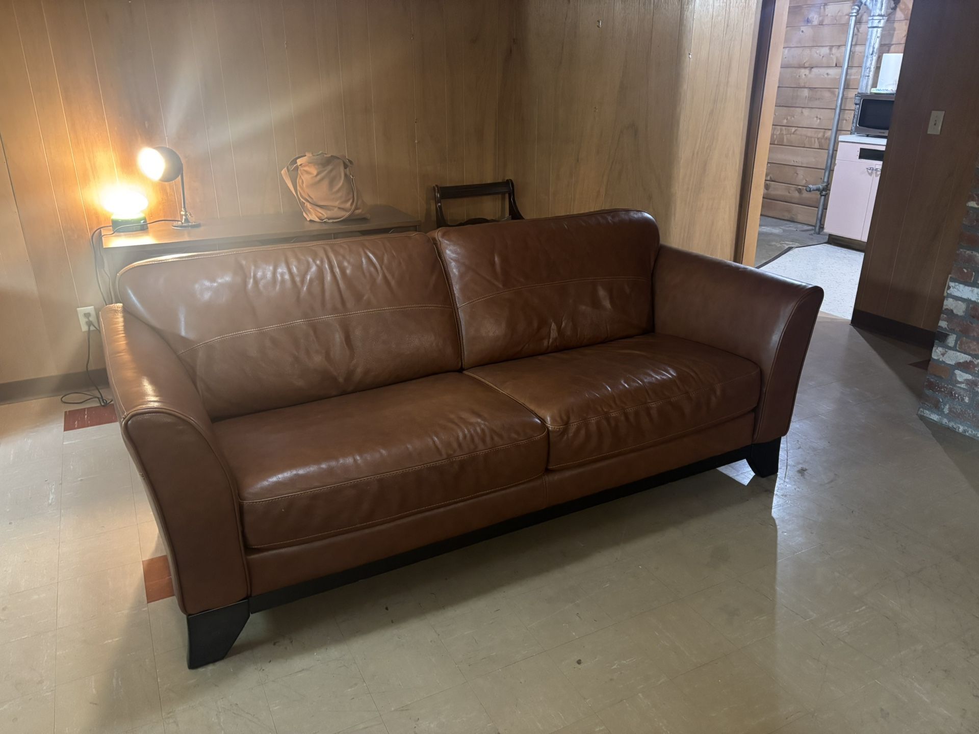 Pair Of Brown Leather Couches And Ottoman