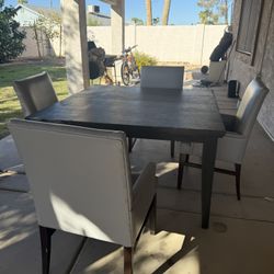 Table And Gray chairs
