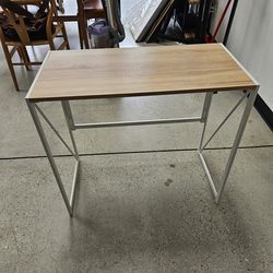 Small white folding desk 31 and 1/2 x15 and 3/4 x28 and 1/2 tall $25 each