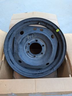 Toyota Tacoma factory steel rim style — 17×7.5", 6-lug (6×5.5" / 6×139.7 mm), multi-hole pattern.