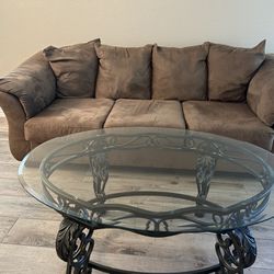 Couch And Oval Glass Coffee Table