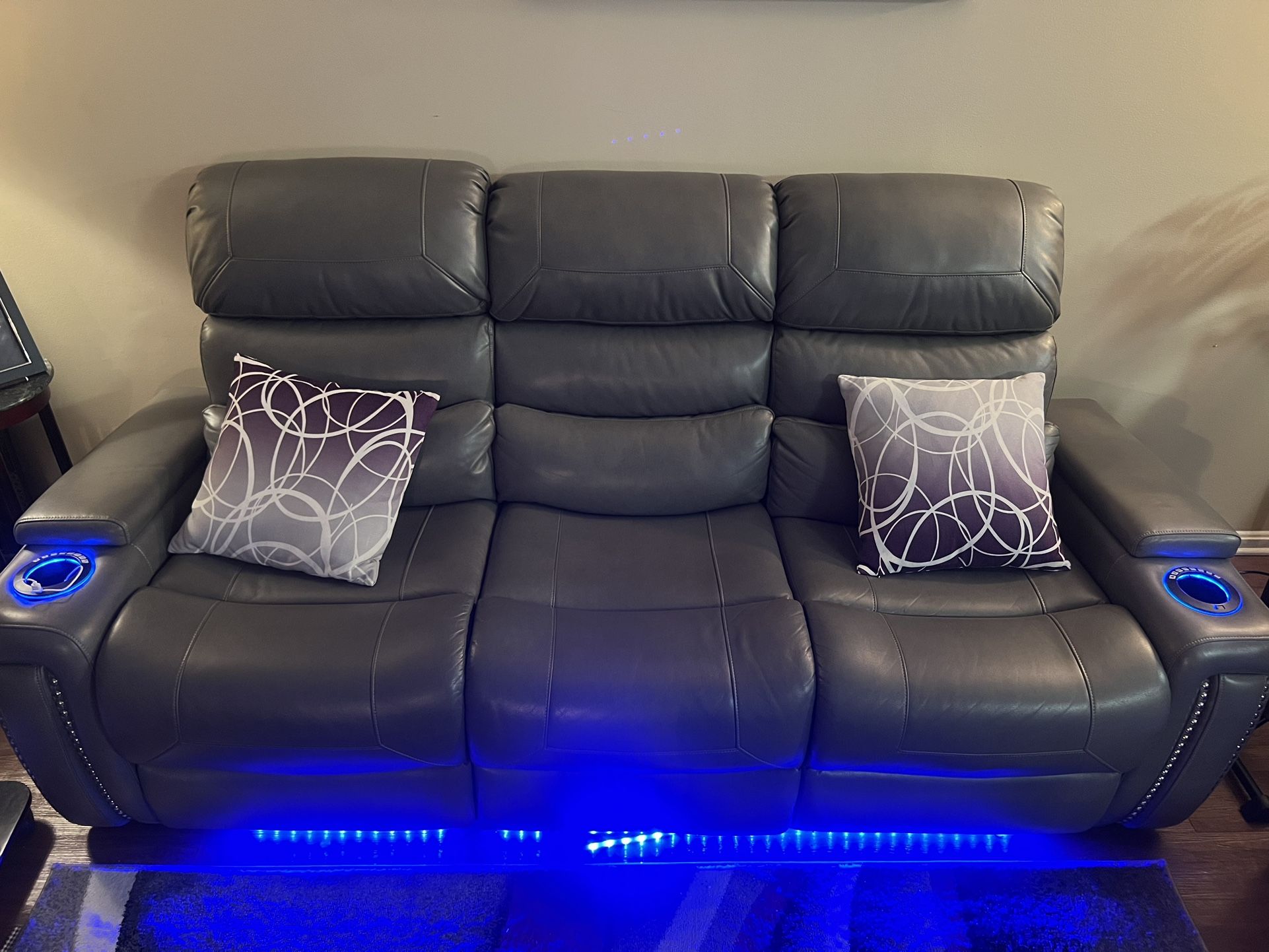 Grey leather glowing sofa , 2 Roll Out Carpet , 2 Corner Tables