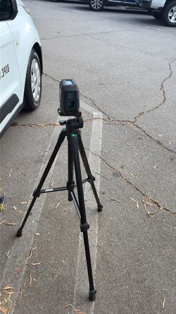 Self leveling laser with tripod