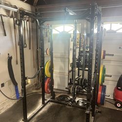 REP Fitness PR-1100 Squat Rack with lat pulldown and weight storage