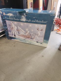 Porcelain Santa with Sleigh and Reindeer Decoration