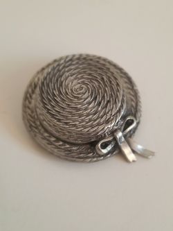 Silver and pewter hat brooch