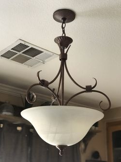 Light fixtures (2)- one hanging chandelier, and the other more flush to the ceiling. Matching pieces.