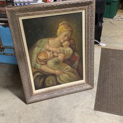 Mother and two children painting on burlap in frame