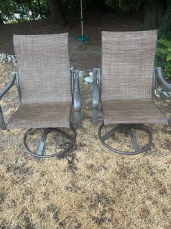 2 Brown woven chairs