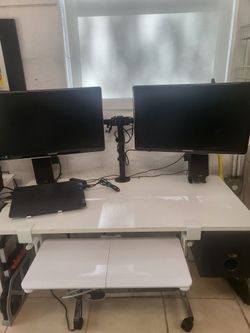 Adjustable height desk with Duel monitors