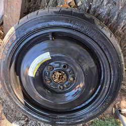 spare tire (or "donut") size  T125/70D15 95M