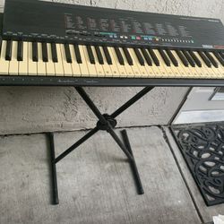Keyboard With A Stand And Stool