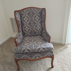 Vintage Wingback Chair Designed Around A Glossy Oakwood Finish And Carved Eagle Claw Legs. $1800.00
