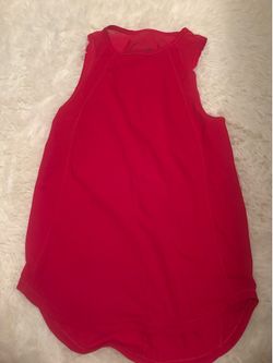 Lululemon Red Tank — Bright red/raspberry with twist back detail. Relaxed flowy fit. Lululemon logo. Excellent used condition.