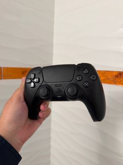Black PlayStation 5 controller mint condition