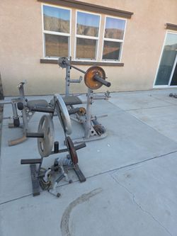 Weider Weight Bench with Barbell and Plates