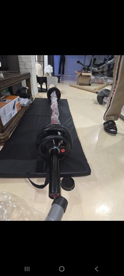 Straight bar 7ft.45lbs. Plus, urethane 55lbs. Olympic plates= 100lbs. BRAND NEW.