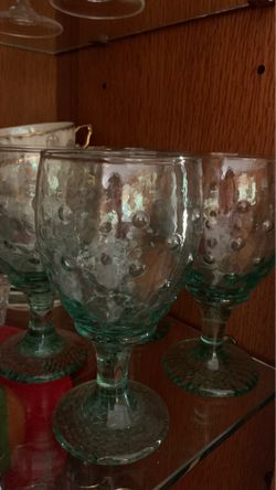 Four green wine glasses