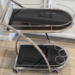 Modern 2-Shelve Chrome Silver Metal Black Rolling Kitchen Bar. Cart Glass With Wheels | 2 Shelf | Storage | Bar Cart. Used, in great condition. 

24"L