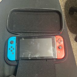 Nintendo Switch With Neon Blue and Neon Red Joy Con Gaming Console - Manufacturer Refurbished