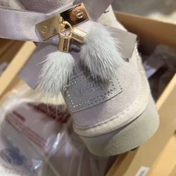 UGG Short Bailey Bow boots with a custom locket
