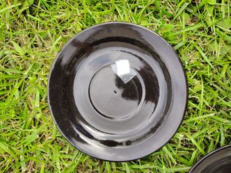 Black ceramic plates and bowl