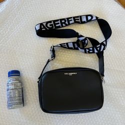 Karl Lagerfeld Hand Bag in Very Good Condition and Comes from a Smoke Free and Pet Free Home. Please Note: Zippers Stick.