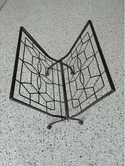 Vintage Wrought Iron Fold Up Magazine Rack. Approx. 15x20. Good Condition.