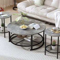 A set of three gray coffee tables