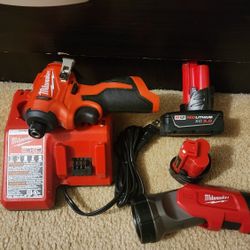 Milwaukee M12 Subcompact Brushless 1/4" Impact Driver on battery  on charge 