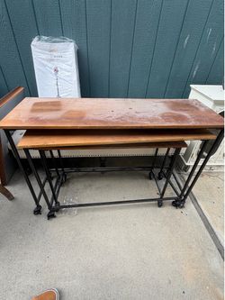 Three stacking tables  all slide under each other
