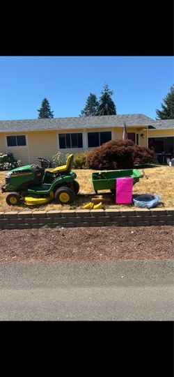 42” cut 20HP tractor with trailer, lift, extra belt and 2 extra sets of blades