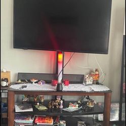 TV STAND W/ TV MOUNT BUILT IN, 3 black glass shelves (nothing 4 sale just tv stand)see pics $125 OBO