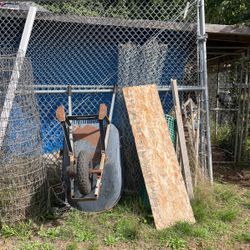 Fence And Wheelbarrow