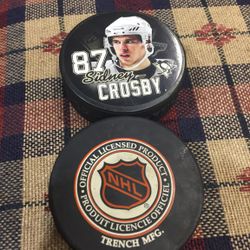Crosby Hockey Puck And NHL Puck 