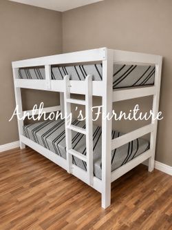 White twin bunk bed and mattress