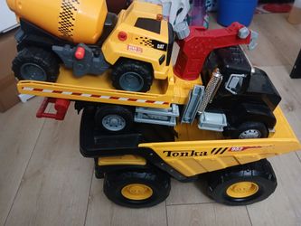 Big tonka  dump truck tow truck and cement mixer.