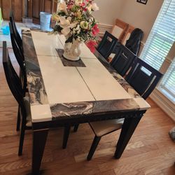 faux-marble dining table  with chairs