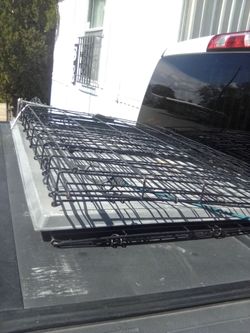 Large dog cage with bottom.
