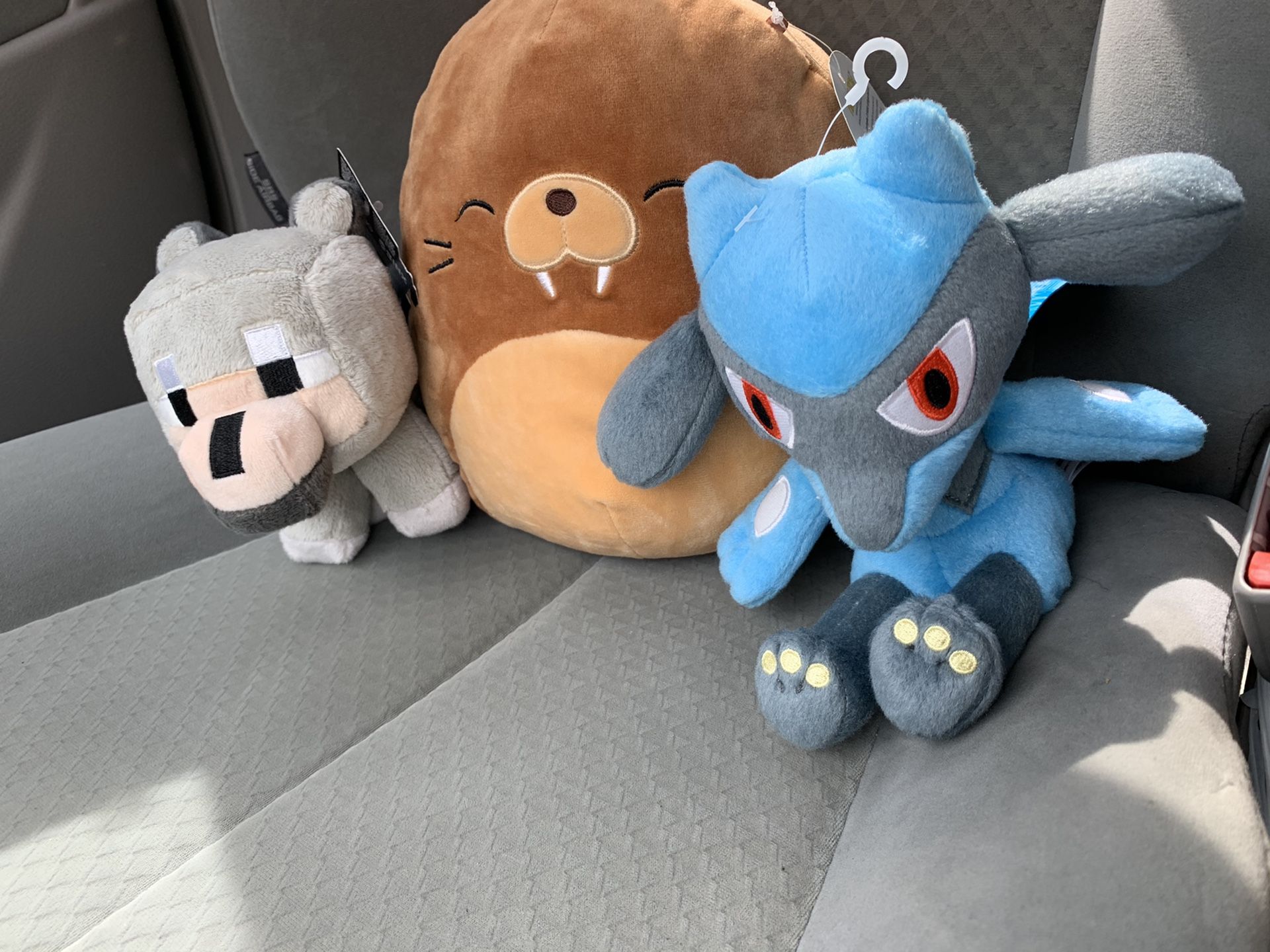 Stuffed animals Pokemon Minecraft and Squishmallows new never used