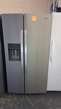 Like new Whirlpool stainless steel side by side refrigerator