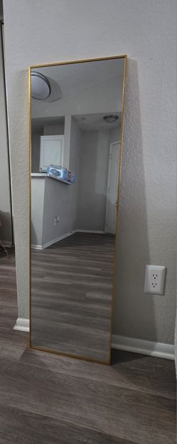 Mirror description 


47 inches height
14.5 width mirror

Full-length rectangular mirror with a slim gold frame. Clean, modern design that works well 